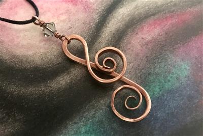 Hammered thick copper wire treble clef pendant with a sparkling 'Black Diamond' Swarovski Crystal accent.
