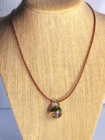 green capped glass mushroom pendant on leather cord