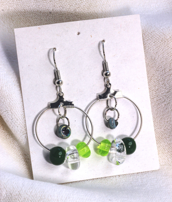 multi bead green/clear insert glass bead hoop earrings