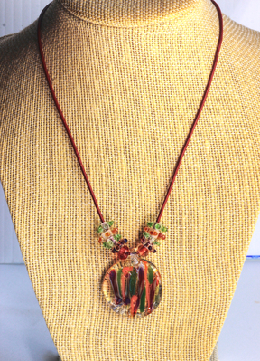 Red/orange/green glass pendant on leather cord