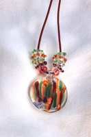 Red/orange/green glass pendant on leather cord